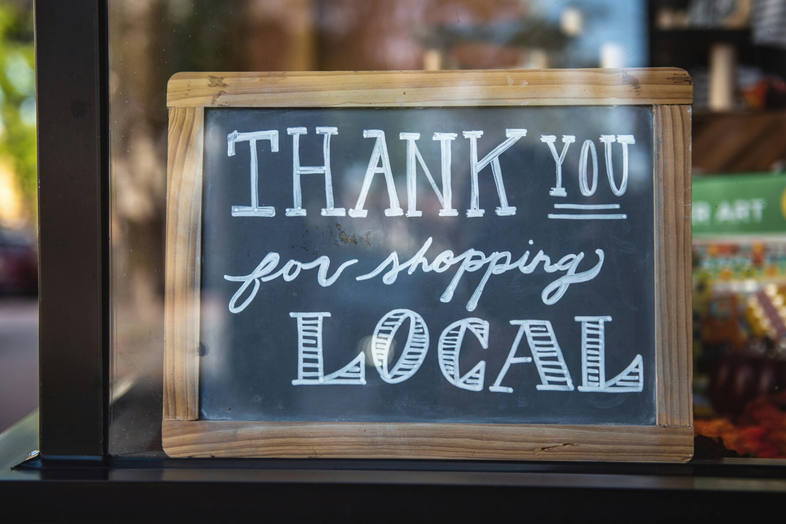 Home Chalkboard sign encourages shopping local in San Luis Obispo store.